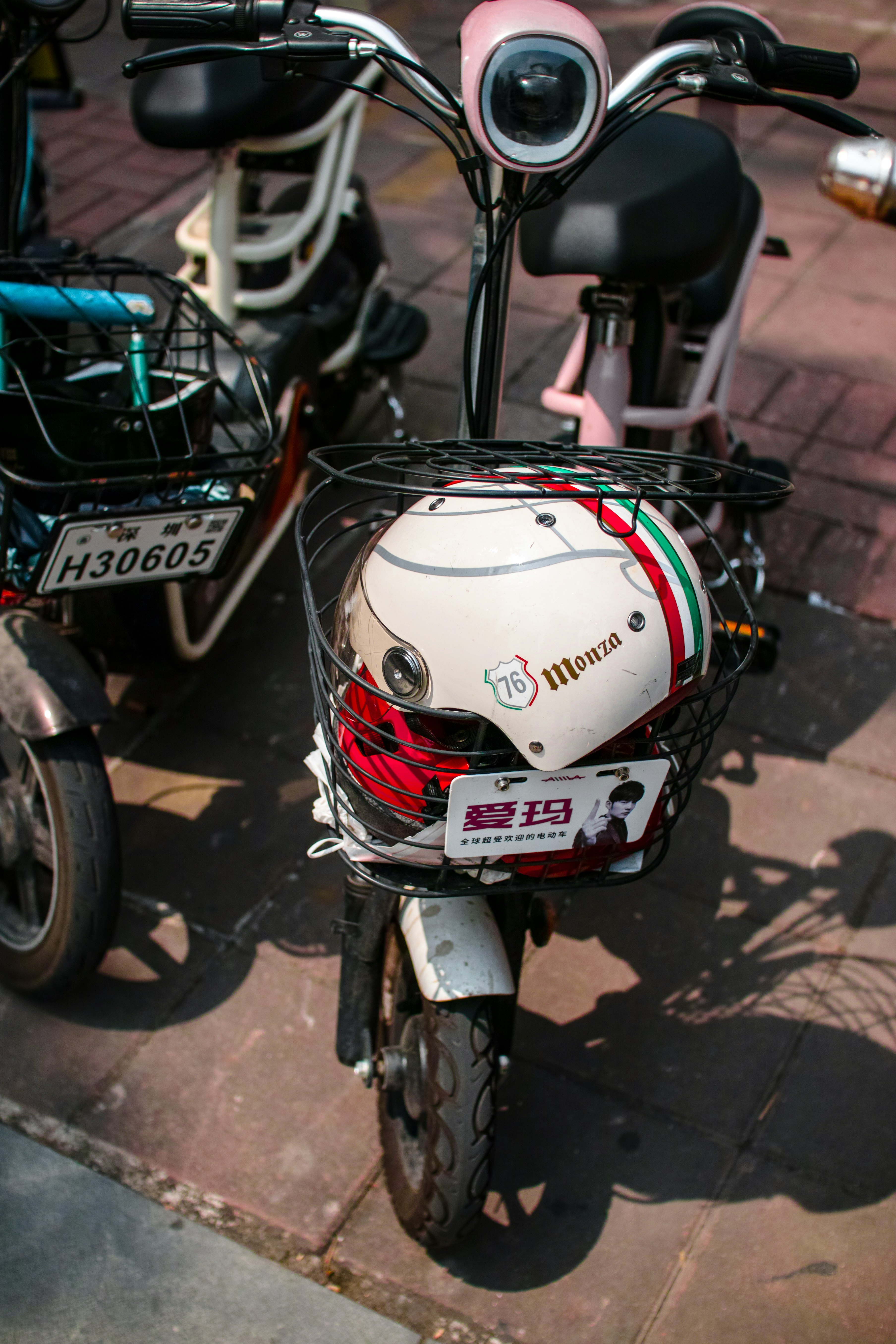 white and red motorcycle helmet on motorcycle